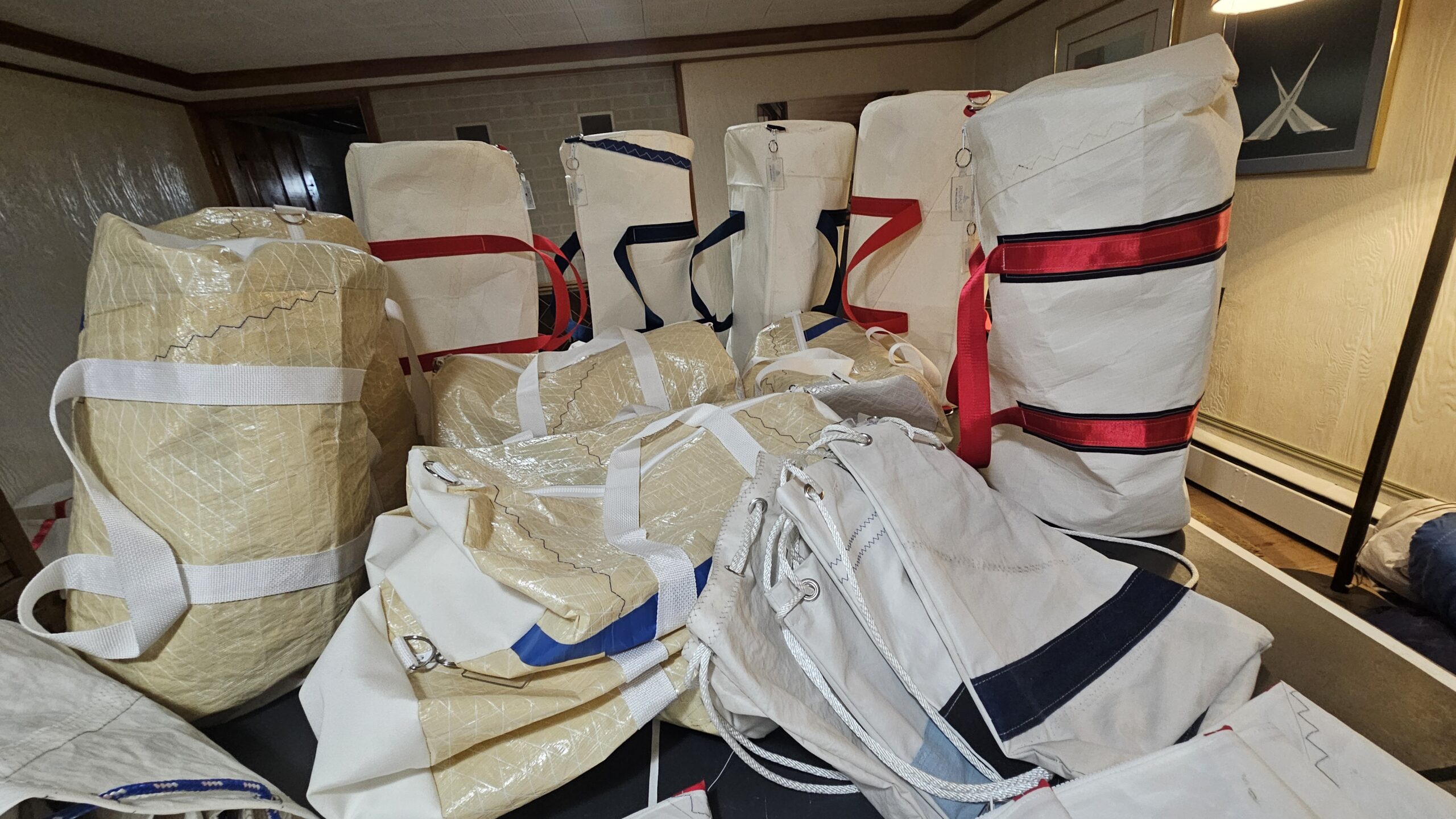 Stacked wrapped packages secured with tape and colored symbols.
