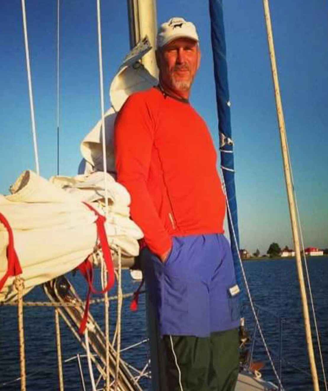 Individual standing on a sailboat deck