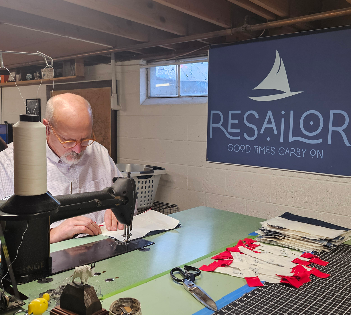 Man sewing in workshop